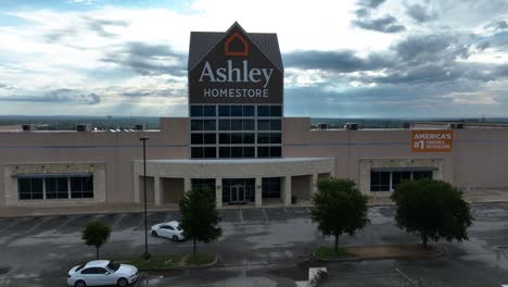 A-4K-Car-Driving-Cinematic-Drone-Shot-of-an-Ashley-Furniture-HomeStore-Global-Industry-Retail-Shopping-Décor-Accessory-Store-Located-in-Chicago-Illinois