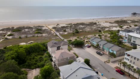 Beach-houses-next-to-a-beach-with-a-boardwalk-that-has-been-recently-repaired
