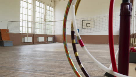 Empty-spacious-Bulgarian-school-gym-with-volleyball-net-and-sport-equipment