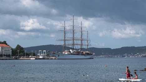 Zadar-four-masts-ship-docked-and-paddle-boarders-passing