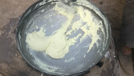 Scene-from-above-showing-the-process-of-making-sweet-batter-from-heated-milk