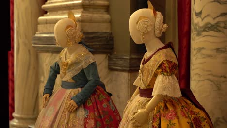 Valencia,-Spain:-Shot-of-two-manikins-in-traditional-Spanish-dresses-inside-a-museum-in-Valencia,-Spain
