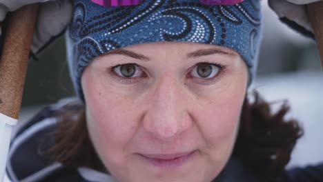 Extreme-close-up-of-female-skiier-pulling-down-googles