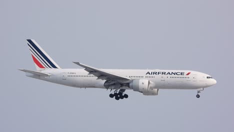 Airfrance-plane-gliding-on-the-sky-in-landing-mode-with-open-gears