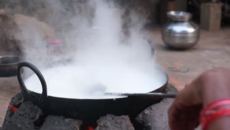 Close-up-scene-with-steam-rising-from-hot-A2-milk-on-stove