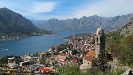 Kotor-Bay-and-Town,-Church-of-Our-Lady-of-Remedy,-cinematic-reveal-shot,-Montenegro