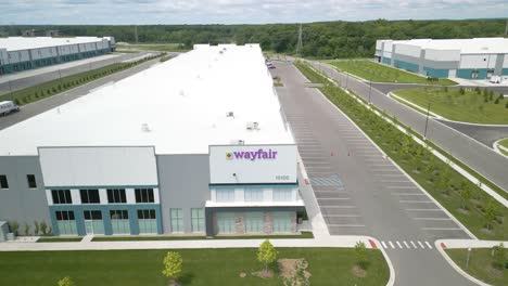 Orbiting-Drone-Shot-Above-Wayfair-Inc-Warehouse-on-Typical-Day