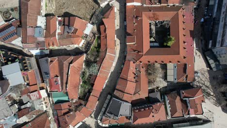 Drone-footage-of-historical-buildings-with-roofs-in-Macedonia,-aerial-view-of-Skopje-bazaar