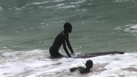 Nigerian-kids-surfing-with-a-makeshift-boards