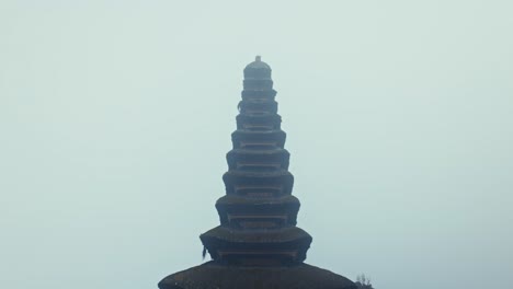 Pura-Ulun-Danu-temple-spire-on-a-mist-covered-morning-Bratan-in-Bali