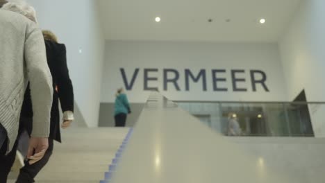 A-Glimpse-of-Art's-Splendor:-Visitors-Ascend-Stairs-at-Rijksmuseum's-Vermeer-Exhibition