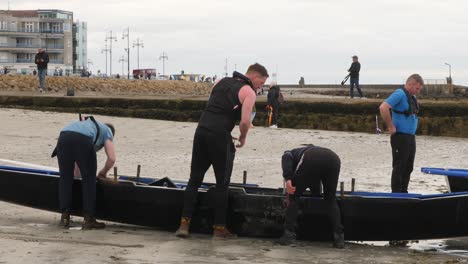 Group-of-paddling-racers-prepare-stretches-for-currach-boat-event