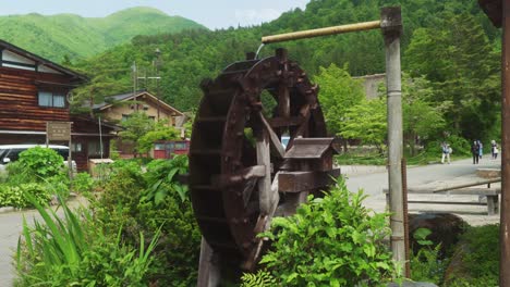 Traditional-Water-Wheel-Beside-Road-In-Village-Town-Of-Shirakawago-In-Gufu
