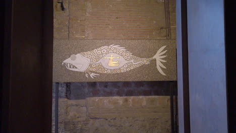Push-in-on-Italian-mosaic-of-a-person-in-a-fish
