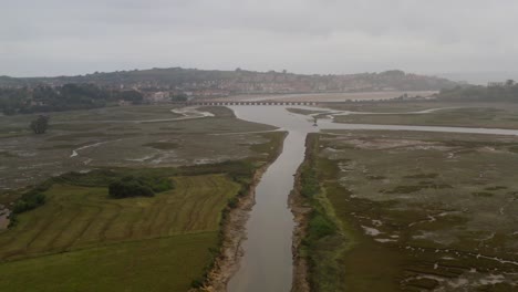 Panoramic-open-landscape-aerial-across-marsh
