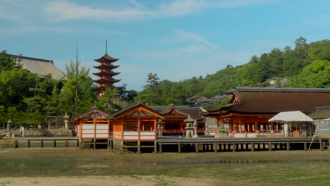 Itukushima-Shrine-Temple-Timelapse-at-Miyajima-island-Hiroshima-Japan-tourist-and-devotes-passing-by-icon-tourism-shintoism