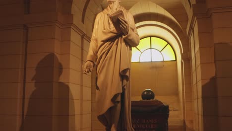Burial-place-and-statue-of-Voltaire-at-the-Pantheon-in-Paris,-France