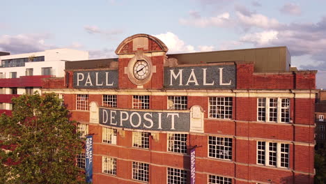 Flying-Drone-Over-Pall-Mall-Deposit-building,-London-W10
