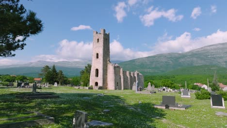 Famous-medieval-church-and-graveyard-remains-in-Cetina,-Croatia,-dolly-backward