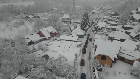 Drone-view-of-an-road-with-snow-and-a-lot-of-cars-stuck-in-snow