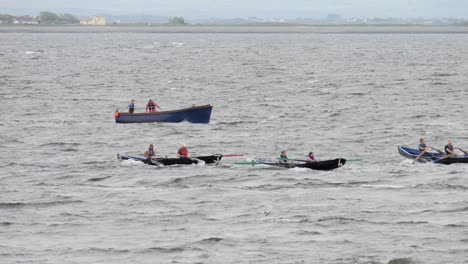 Currach-boats-racing-in-pairs-of-people-slow-motion-in-glaway-bay-ireland