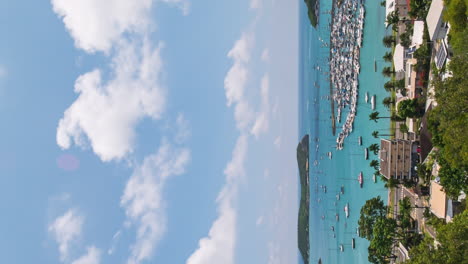 Boats-anchored-in-Baie-de-l'orphelinat-or-Orphanage-Bay-in-Nouméa,-New-Caledonia---vertical-time-lapse