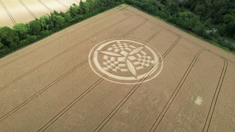 Wind-blowing-patterns-across-golden-Hampshire-wheat-field-crop-circle,-Aerial-view-South-Wonston-2023