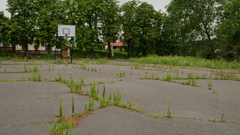 Overgrown-neglected-basketball-playground-in-Eastern-European-state-school