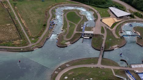 Lee-valley-white-water-centre-aerial-view-looking-down-over-kayak-and-paddle-board-training,-London,-England