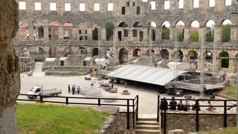 Contractors-building-a-structure-for-an-event-inside-the-Arena-of-Pula