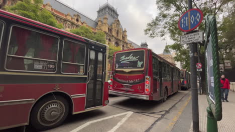 Red-buses-stand-in-a-traffic-jam,-public-transport,-the-center-of-Buenos-Aires