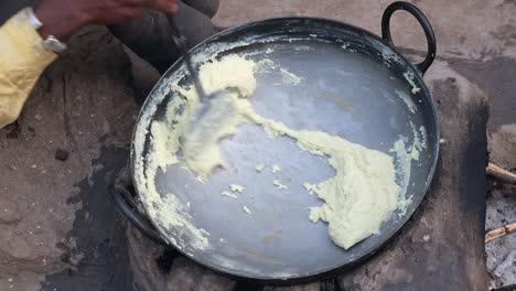 Scene-from-above-showing-fresh-curd-being-made-from-so-much-milk-by-a-confectioner