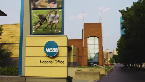 Sign-Of-NCAA-National-Office-Outside-The-Hall-Of-Champions-Building-In-White-River-State-Park,-Indianapolis,-Indiana,-USA