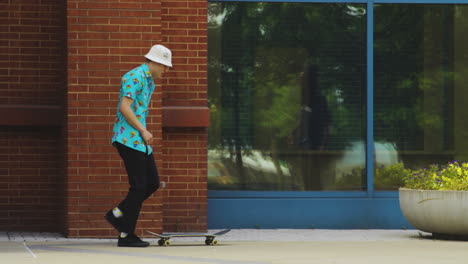 Afro-American-Man-Teaching-Amateur-Skateboarder-How-To-Jump-On-Skateboard