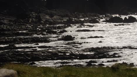 long-shot-of-waves-rolling-onto-sedimentary-rocks-at-Hartland-Quay,-Stoke,-Hartland,-Bideford