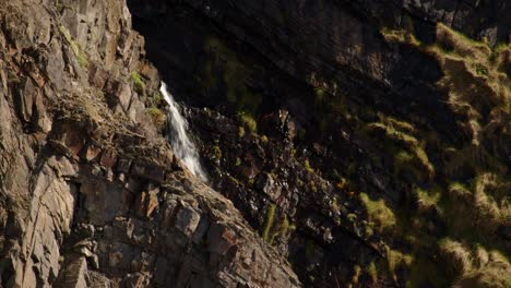 Wide-shot-of-waterfall-on-the-Cornish-coast-at-Hartland-Quay,-Stoke,-Hartland,-Bideford