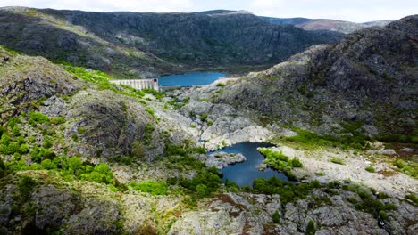 Aerial-dolly-push-in-to-incredible-dam-lake-and-river-winding-across-rocky-tera-canyon-zamora-spain-landscape,-drone