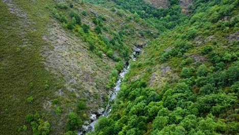 Bibei-bibay-river-flowing-strong-through-mountains-cutting-down-canyon