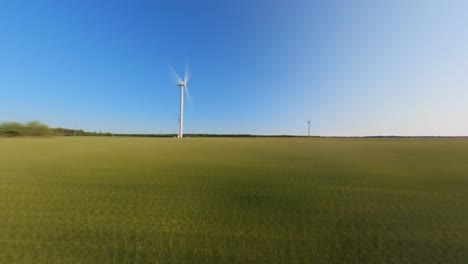 Hyperlapse-Shot-Of-Wind-Farm-Turbine-in-the-Agricultural-Fields-on-a-Sunny-Summer-Day