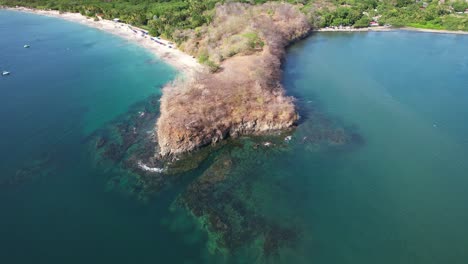 Aerial-Drone-Flyover-Costa-Rica-Beach-Headland-With-Blue-Ocean-View,-4K