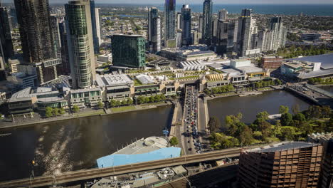 Melbourne-Crown-over-River-timelapse-from-Rialto-towers-level-30-Melbourne-South-bank-peak-hour-traffic-nice-sunny-day-Albert-Park-in-the-distance-high-rise-buildings