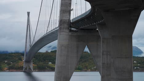 Massive-concrete-supports-of-the-Halogaland-Bridge-tower-above-the-calm-waters-of-the-fjord