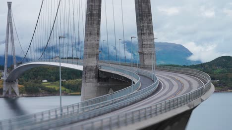Cars-and-trucks-pass-along-the-curves-of-the-Halogaand-Bridge-above-the-fjord
