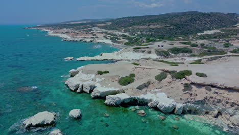 Flying-over-white-rocks-tourist-spot-in-Cyprus,-aerial