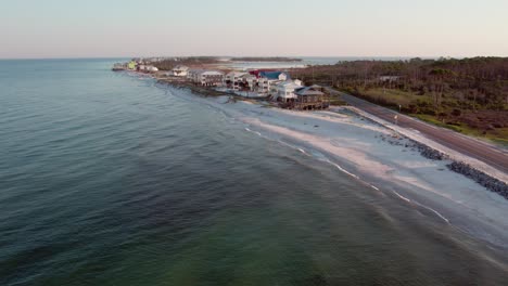 Aerial-flight-towards-beach-front-homes-in-Cape-San-Blas,-Florida