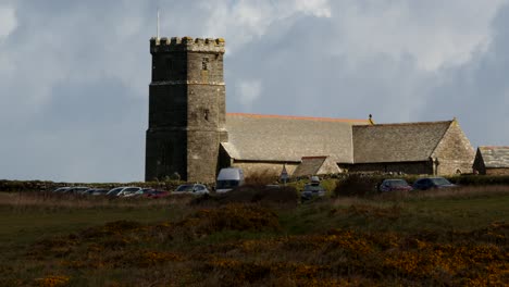 Wide-shot-of-St-Materiana's-Church,-Tintagel,-with-Cloud-shadow,-moving-over-roofline
