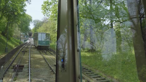 Two-railway-cars-of-the-Petřín-funicular-passing-each-other