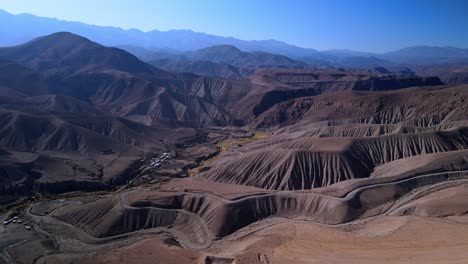Aerial-view-of-a-village-in-Atacama-desert,-Chile---rising,-drone-shot