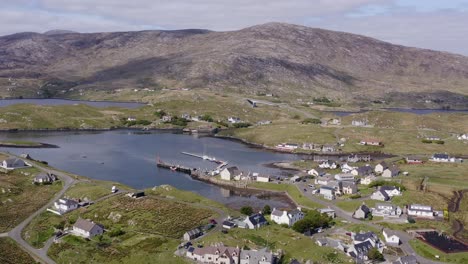 Drone-shot-circling-the-village-on-the-Isle-of-Scalpay,-an-island-near-the-Isles-of-Harris-and-Lewis-on-the-Outer-Hebrides-of-Scotland