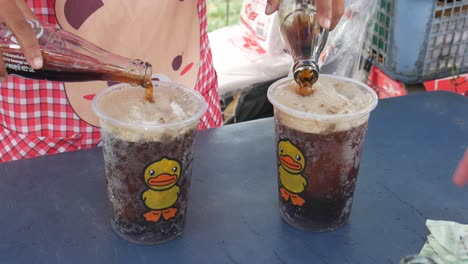 Thailand-drive-beverage-pooling-cold-coke-into-frozen-ice-in-hot-summer